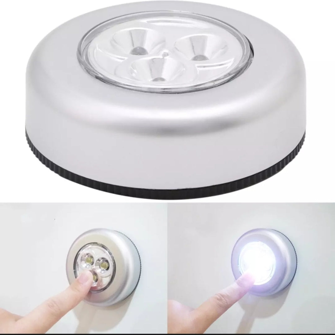 Round light fixture with a switch and LED light on a white background